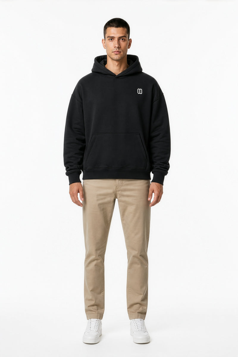 Black Essential Oversized Boxy Fleece Hoodie – Front on Model | TheTwoZero